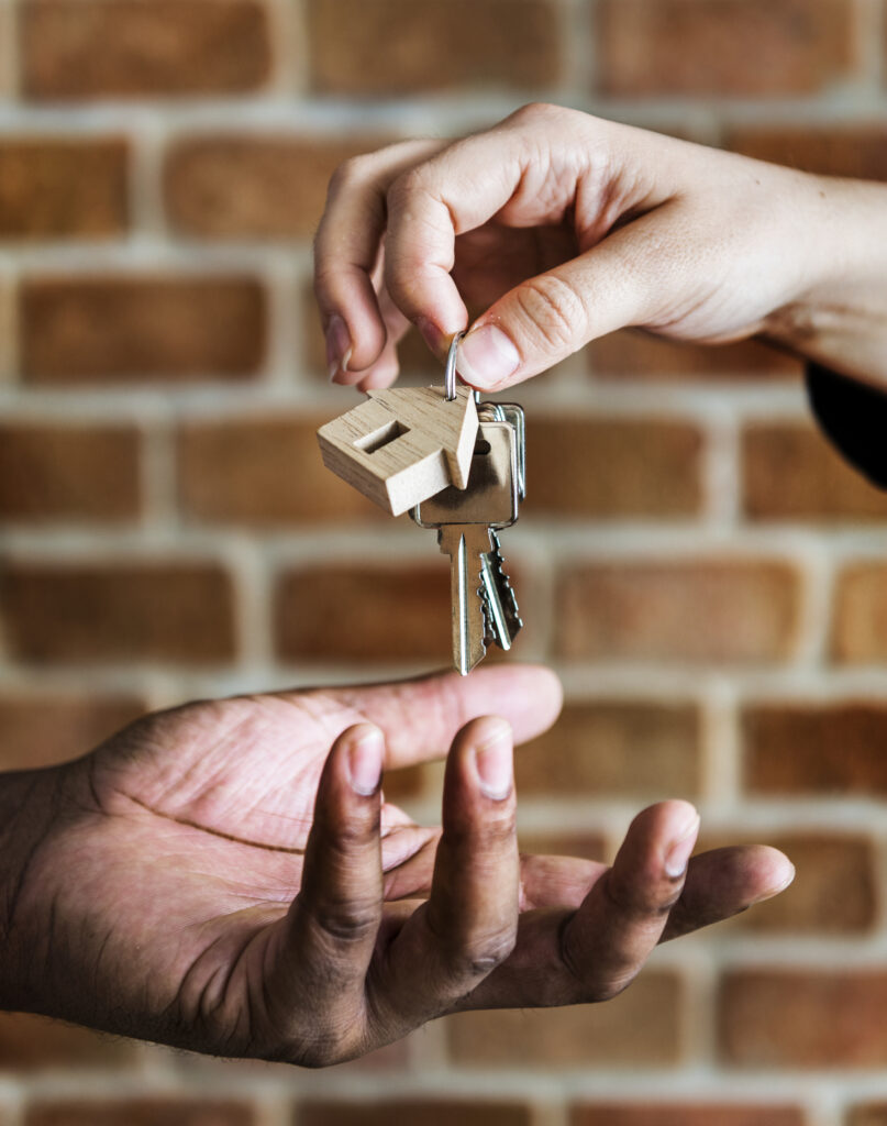 Hand passing a keys to hand